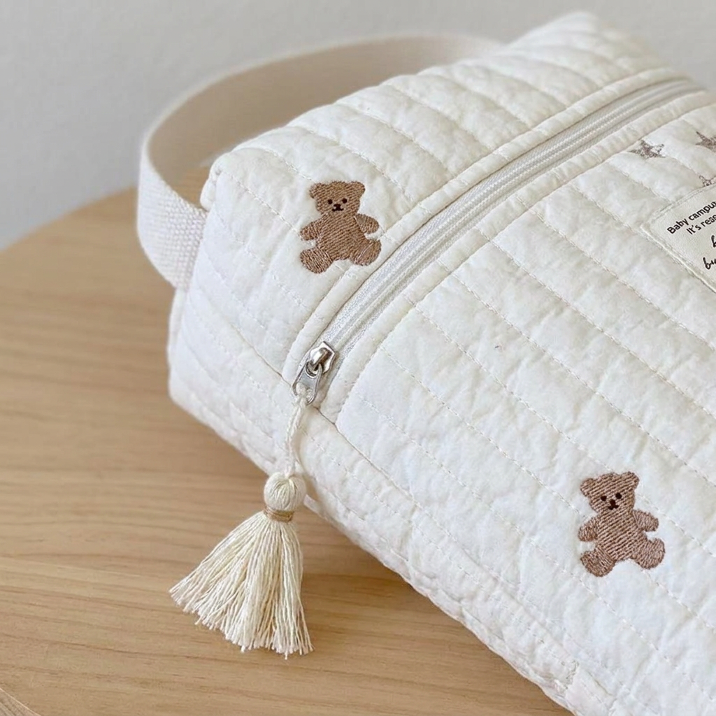 Close-up of diaper caddy zipper closure and quilted fabric texture